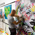 Artists, Gregos (left) and Jo Di Bona (right) creating live art on the night